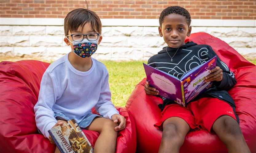 Students read books outside